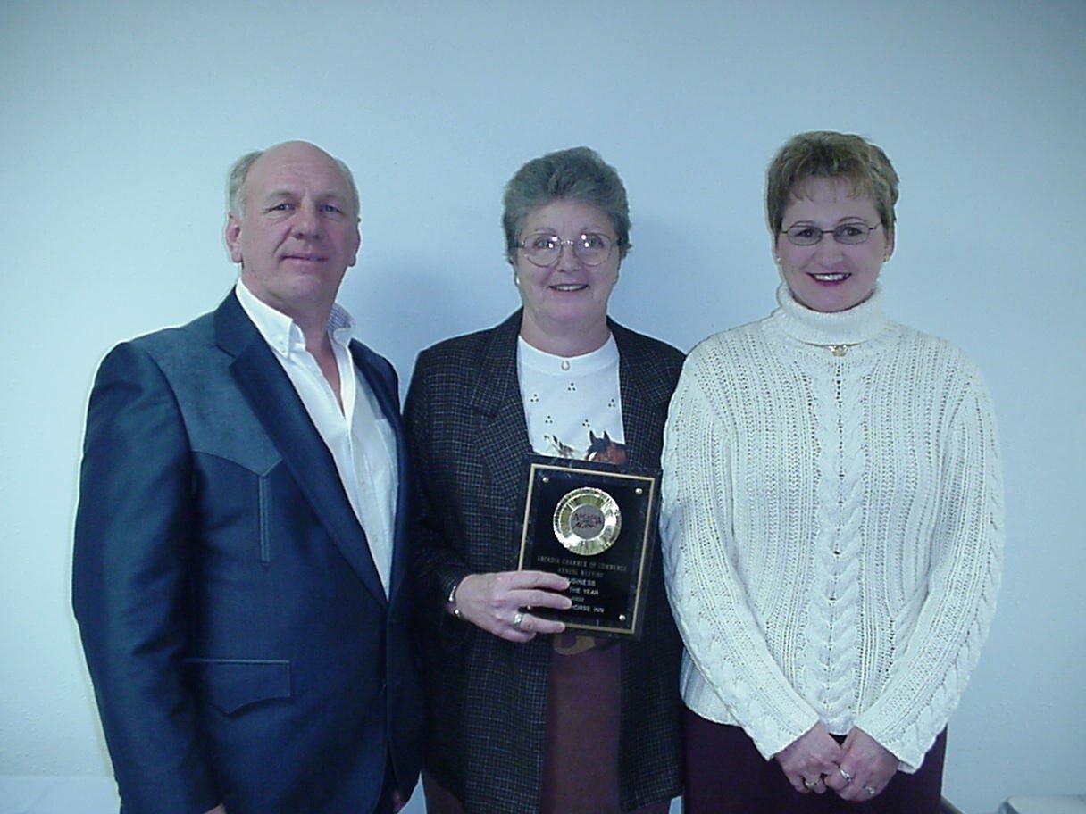 Draft Horse Inn Owners, Ron and Connie Soppa receive the Business of the Year Award from Sue Kiehl